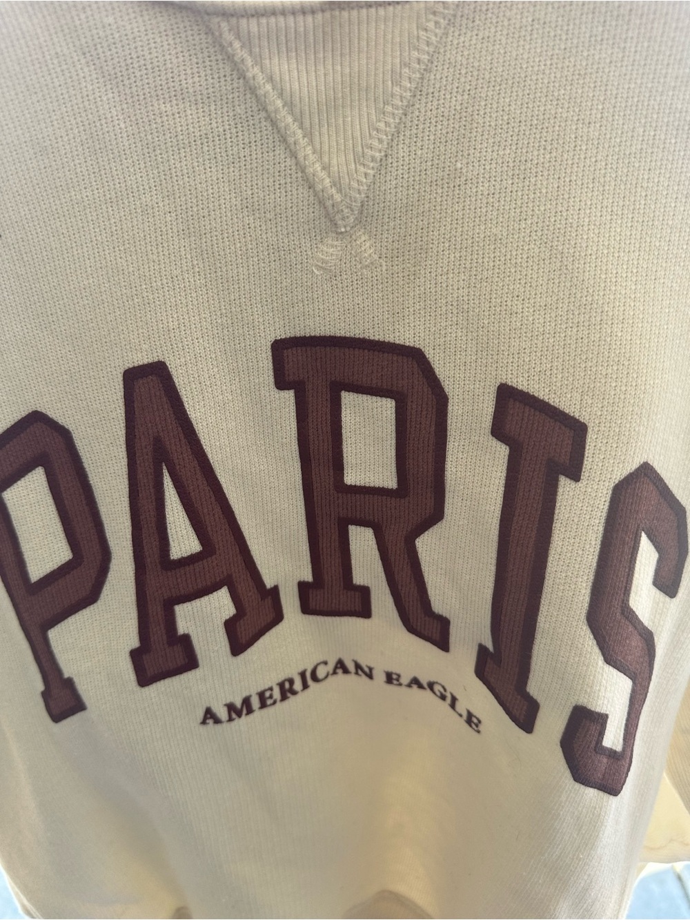 American Eagle Outfitters Cream Crewneck Sweater with Maroon 'PARIS' Appliqué